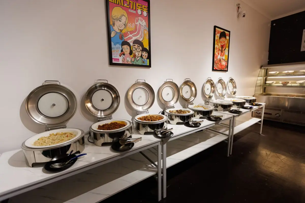Cooked buffet dishes in warmers at GOGI Korean BBQ Buffet