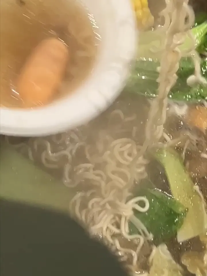 Noodles lifted from a simmering hot pot at GOGI Geelong