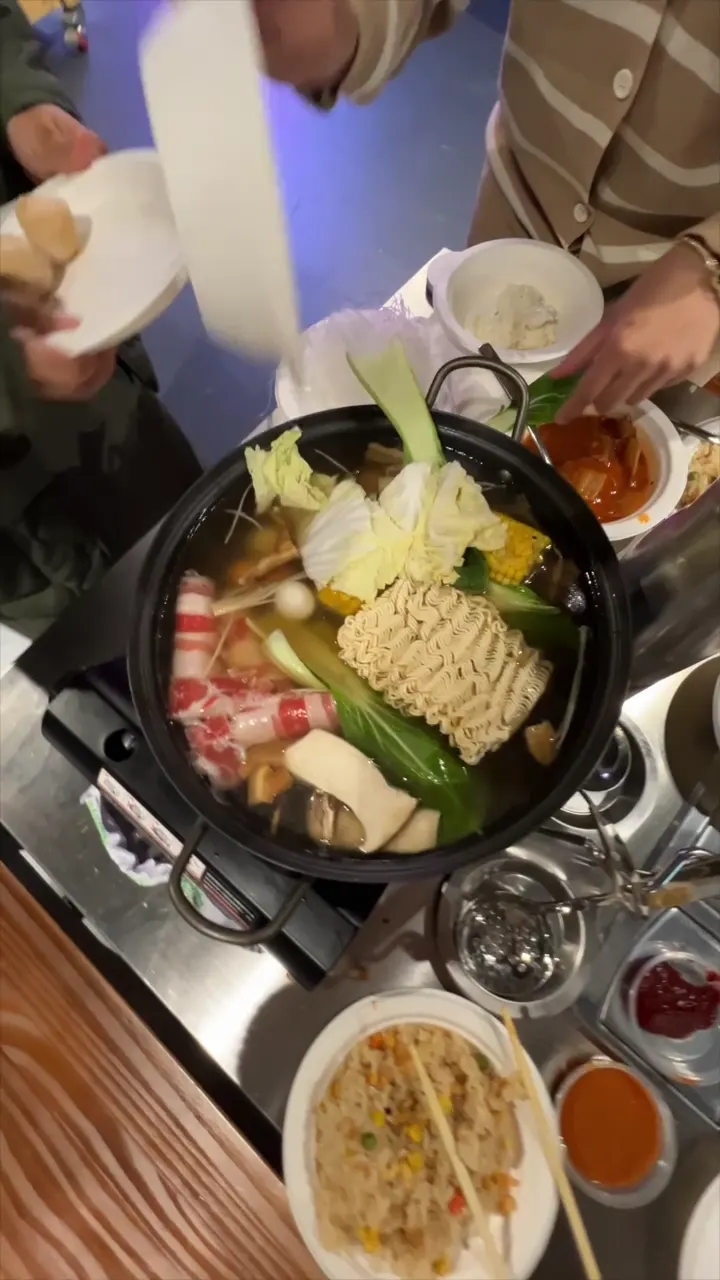 A loaded hot pot simmering at the table at GOGI Geelong
